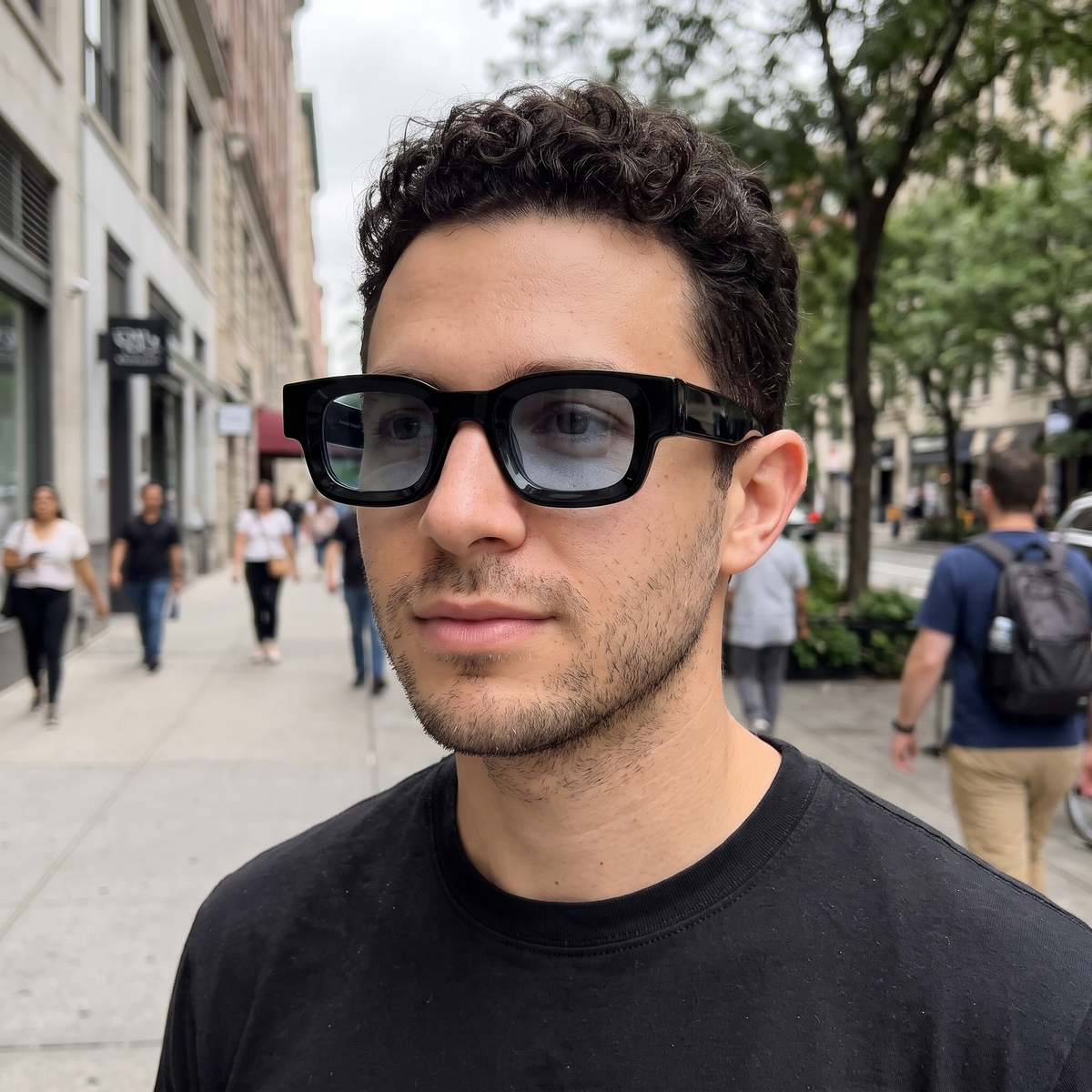 K1 Meridian sunglasses in Black / Ice Blue, worn by a man