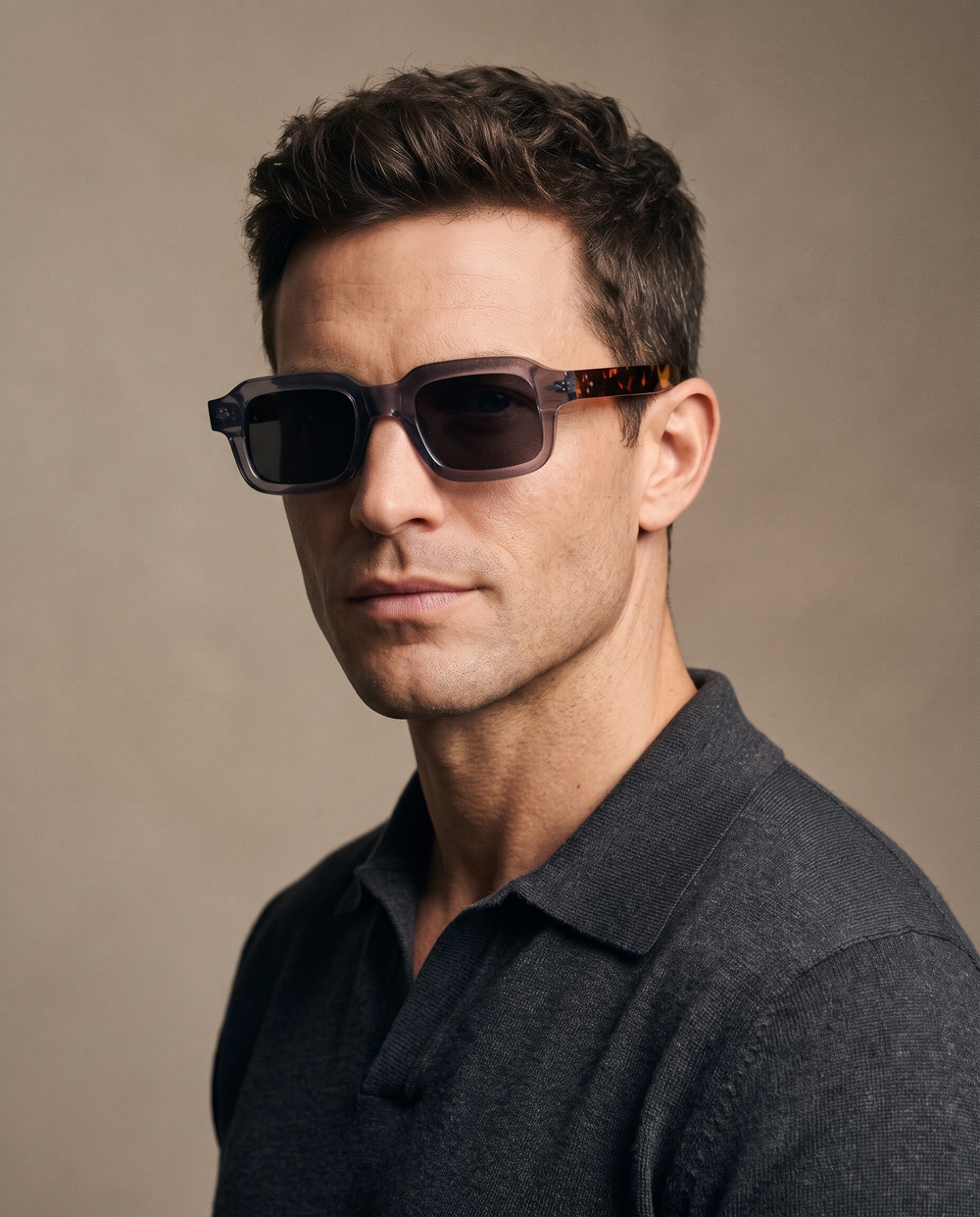 Studio portrait of a man wearing Kelvin sunglasses